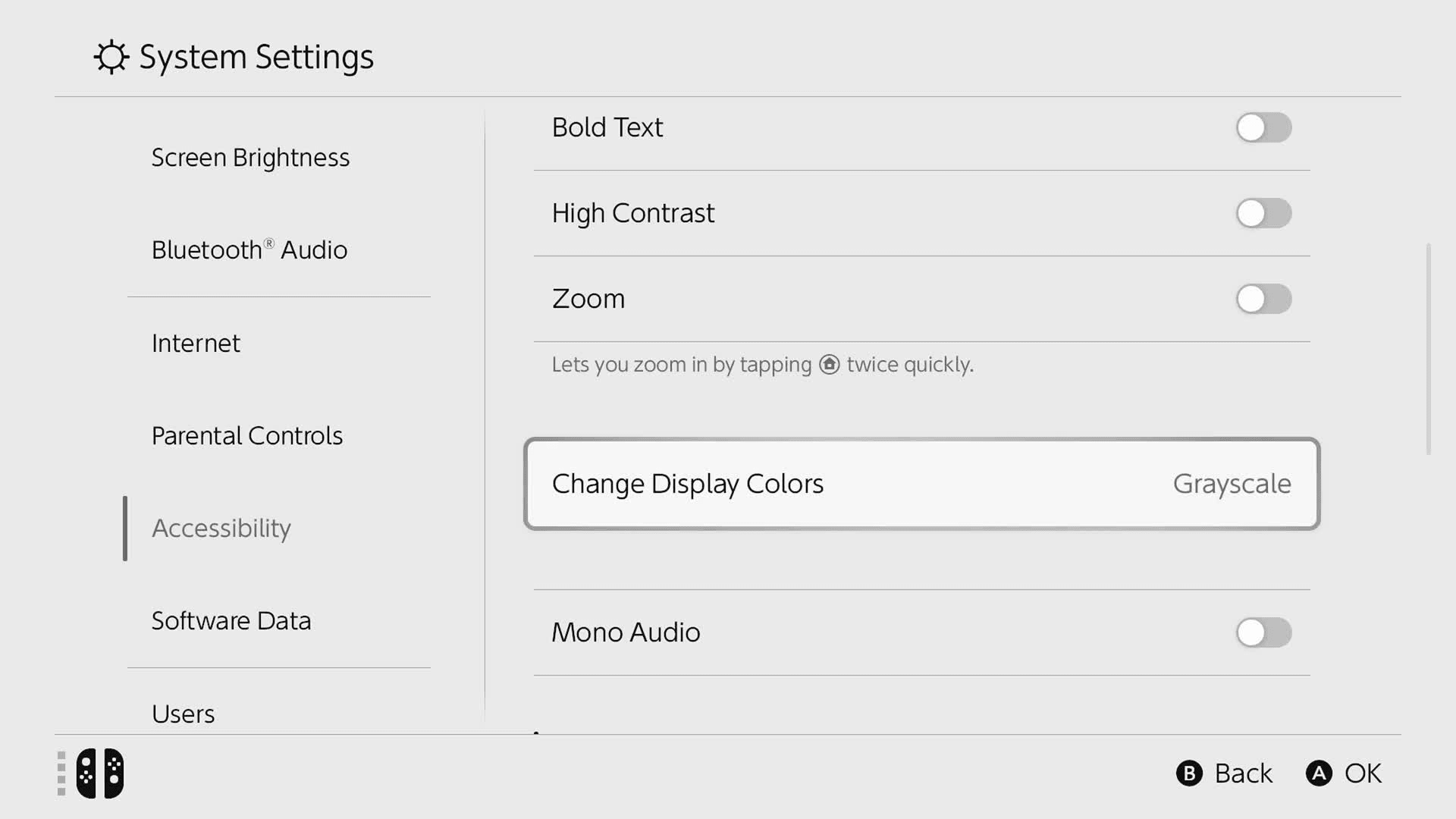 Screenshot of video demonstating changing display colours to 'Invert Colours' and 'Grayscale' in settings menu in accessibility submenu